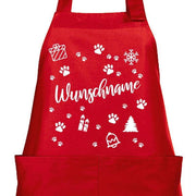 Rote Kochschürze mit Weihnachtsmotiv aus Pfoten, Geschenk, Tannenbaum und Wunschname in der Mitte
