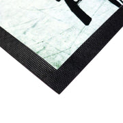 Ecke der Foto-Fußmatte mit rutschfestem Gummirand und Druckfläche aus Polyester